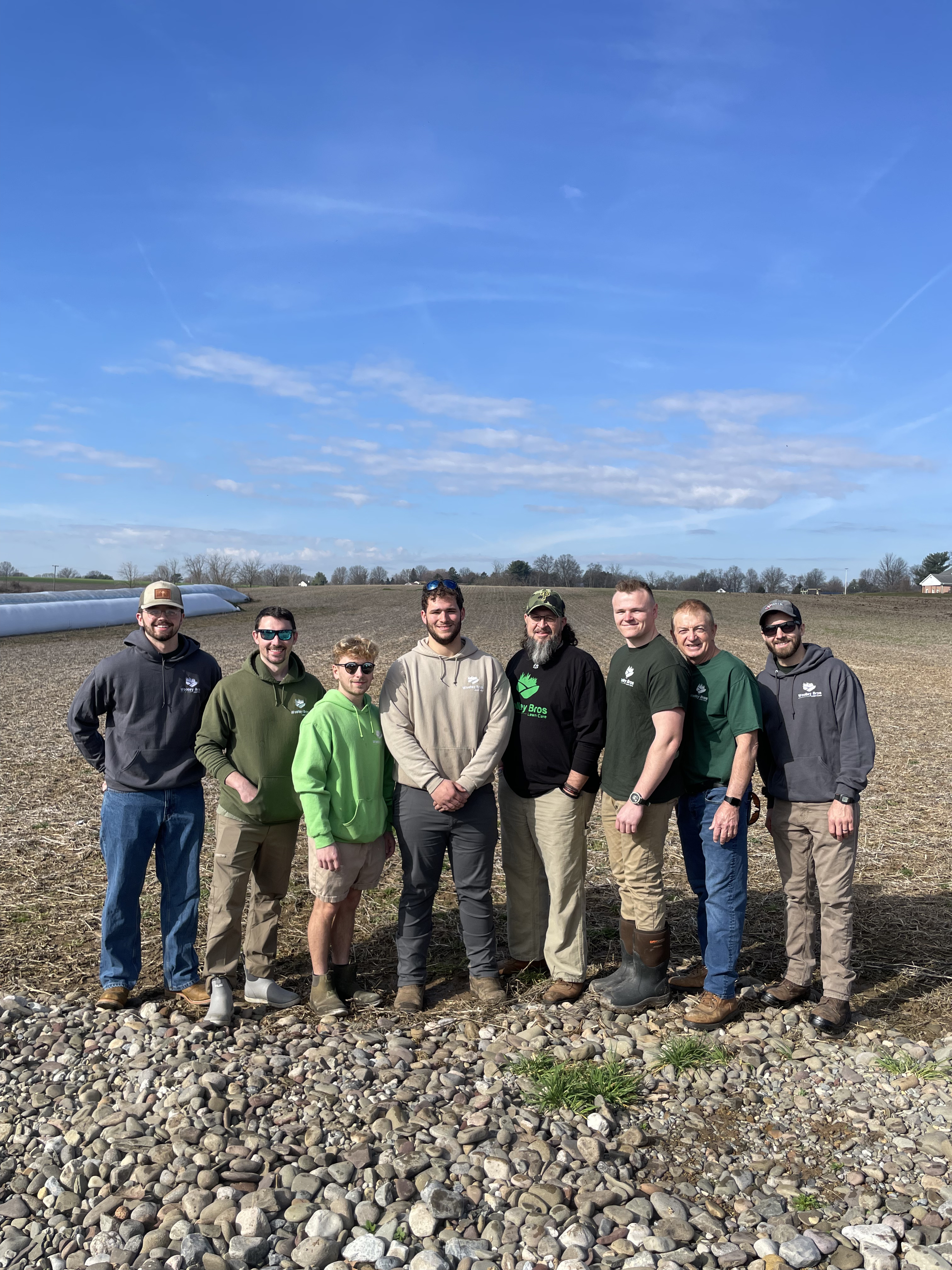 Woolley Bros leadership team standing together on their property
