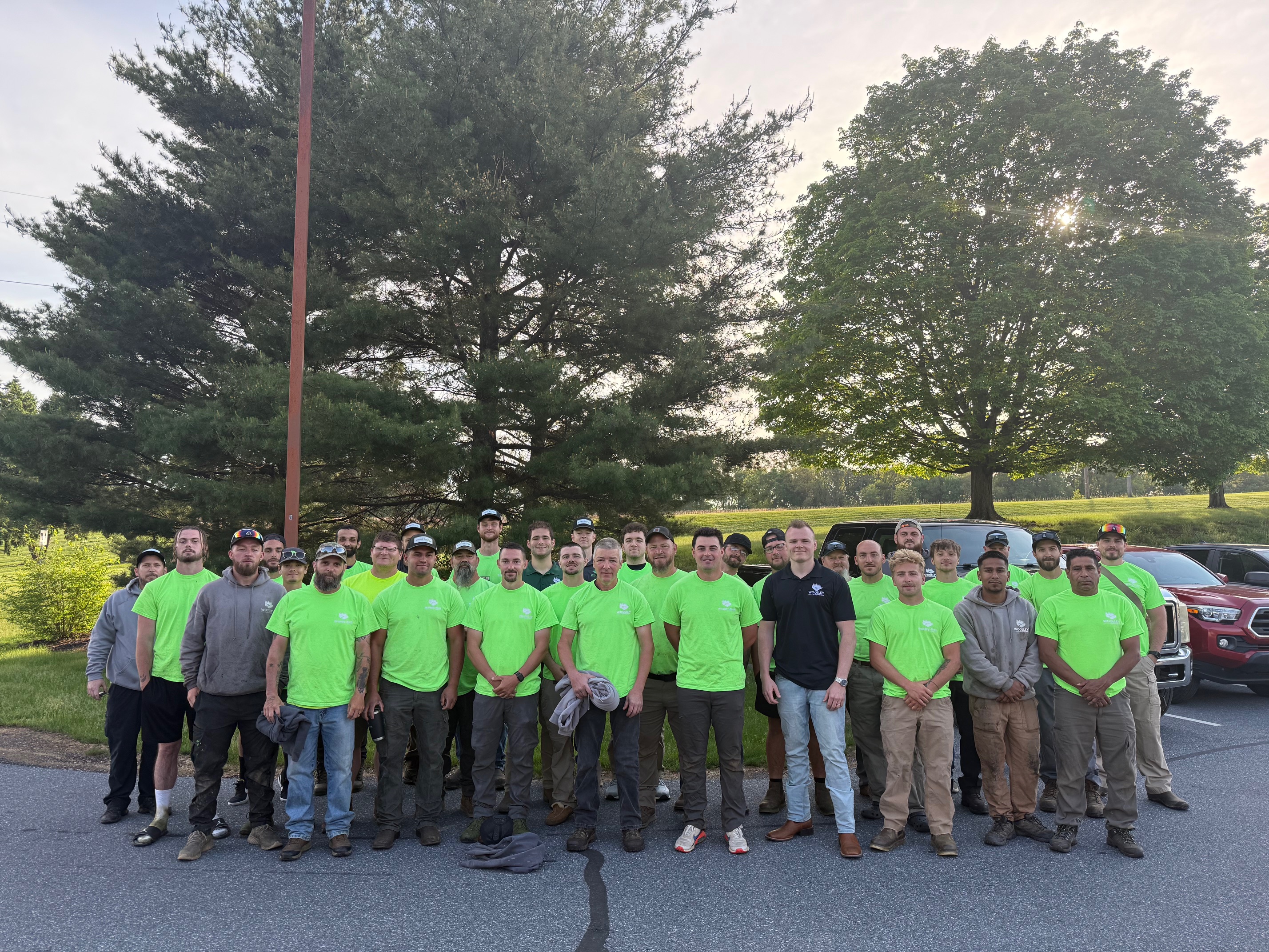 Woolley Outdoors team photo showing their full crew in company shirts